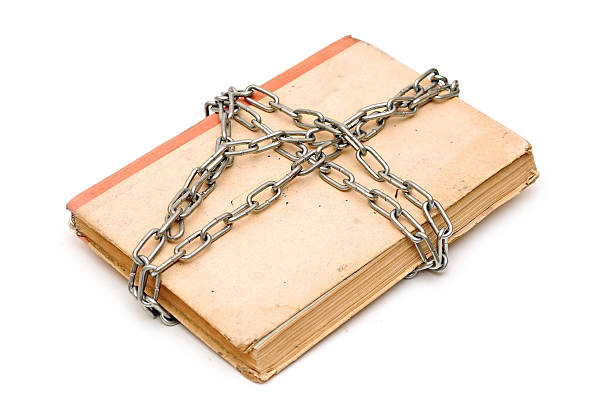 istock old book with chain isolated on white background 465158589