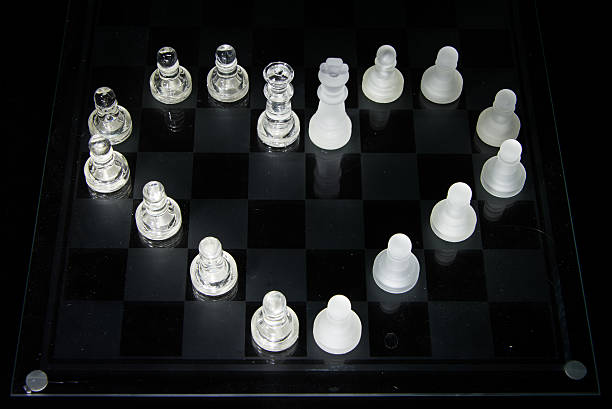 Glass Chess Pieces Arranged as a Heart stock photo