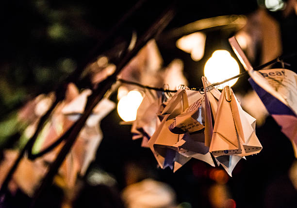 istock Origami hung from arches at night 465159711