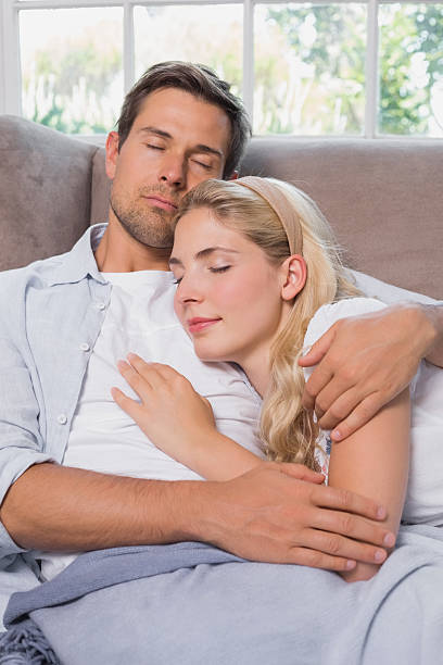 istock Relaxed loving couple sleeping together on sofa 465159774