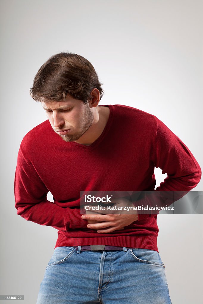 Nausea Young man feel bad because of stomach problems Abdomen Stock Photo