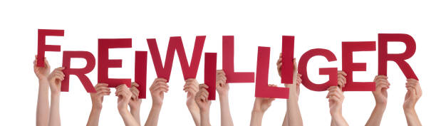 istock People Holding Red German Word Freiwilliger Means Volunteer 465160390