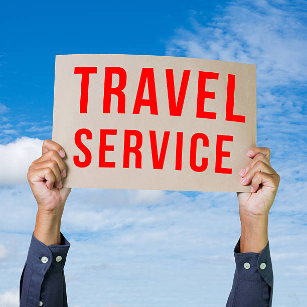 istock Man hand holding paper with travel service word 465160655