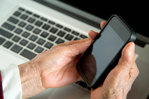 istock Senior hands holding mobile phone 465163269