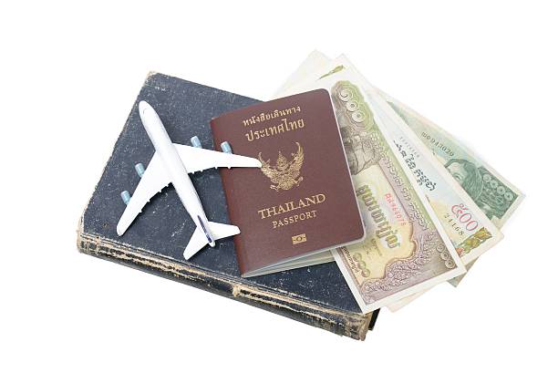 istock Cambodian banknotes and Thailand passport 465163497