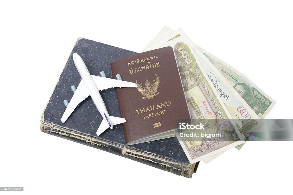 Cambodian banknotes and Thailand passport Cambodian banknotes and Thailand passport on the old book Airport Stock Photo