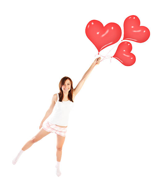 istock Girl with heart balloons 465164533