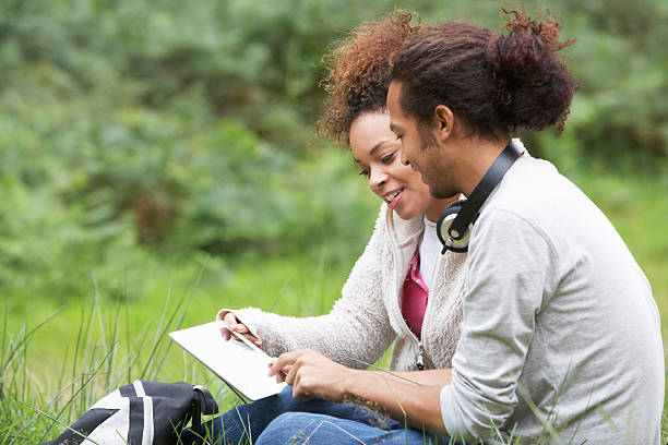 istock Couple Using Digital Tablet Whilst Hiking In Countryside 465165509