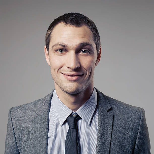 istock Pleasant businessman portrait on grey background 465165517