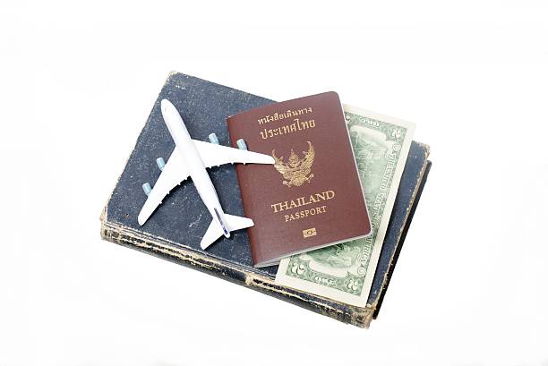 istock us dollar bills with Thailand passport 465166279