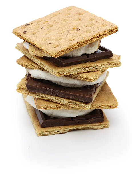 s’more, campfire treat S’more is a campfire treat popular in the United States and Canada. smore photos stock pictures, royalty-free photos & images