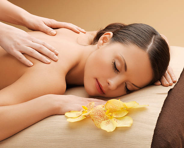 istock beautiful woman in massage salon 465171165