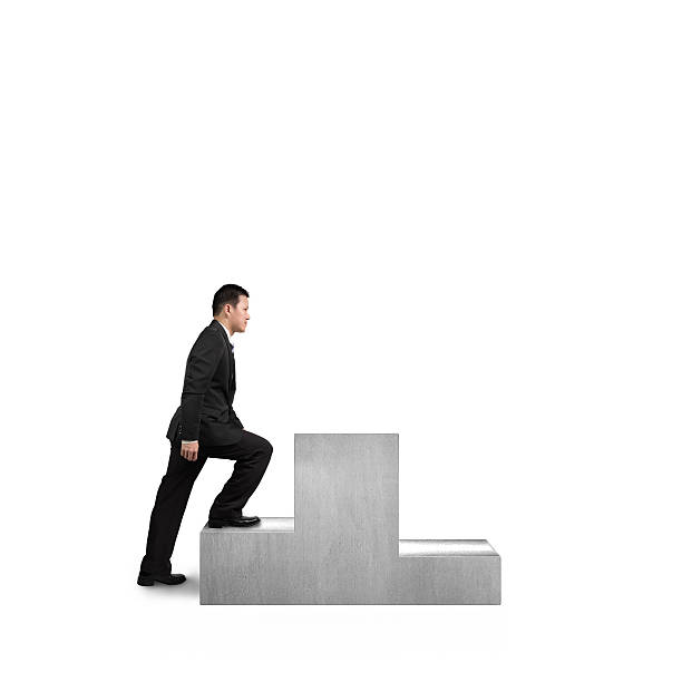 istock Businessman climbing on podium 465171499
