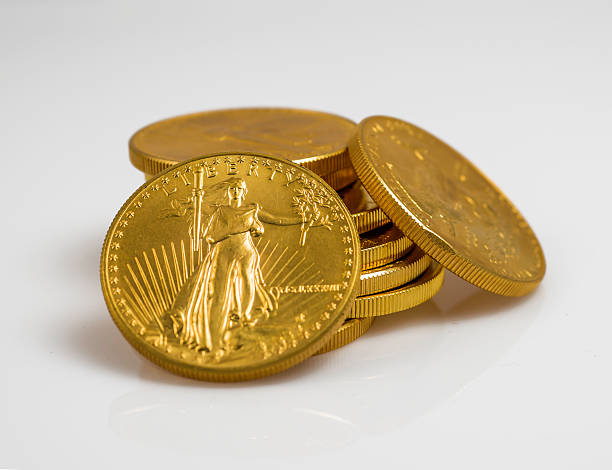 istock American gold eagle coins stacked on white background. 465172471