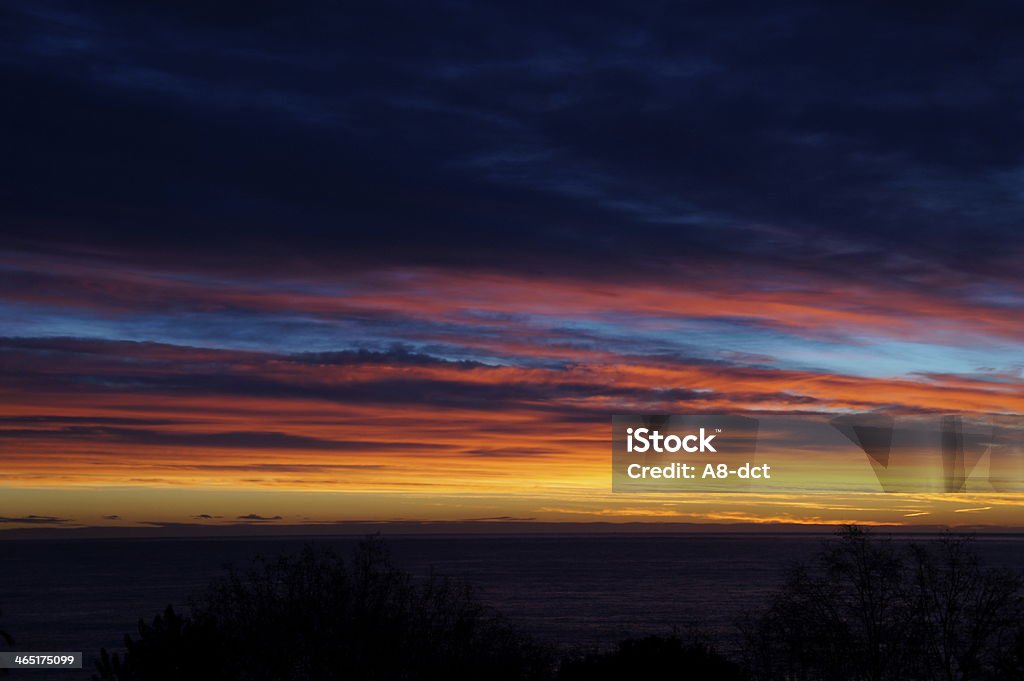 beautiful winter sky image of a sky with multiple colors over mediterranean sea in spain. Blue Stock Photo