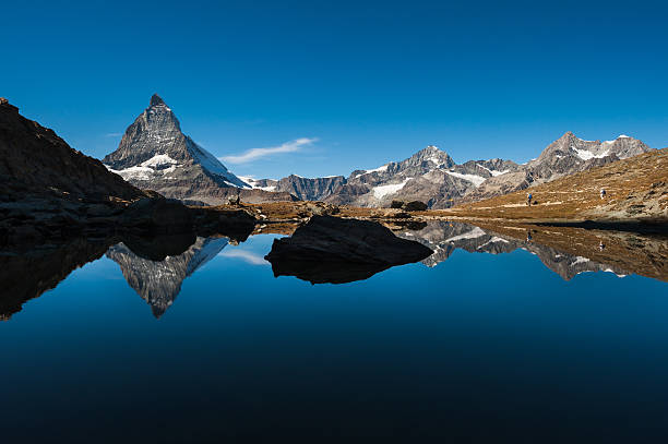 istock Matterhorn and reflection in Riffelsee lake 465176519