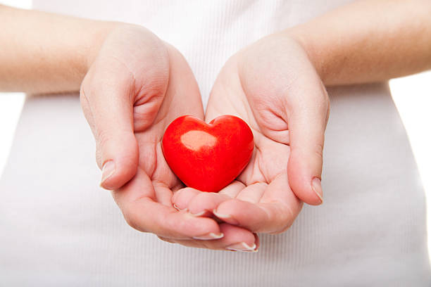 istock Woman's hand with heart symbol isolated on white 465183523