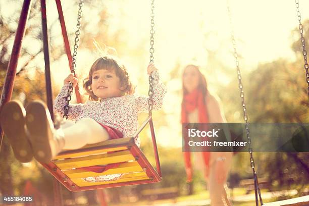 Little Girl On A Swing Stock Photo - Download Image Now - Family, Public Park, Child