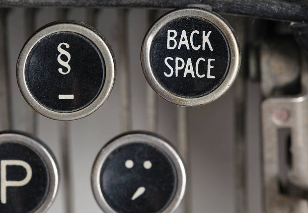 istock close up of an old typewriter back space key 465184271