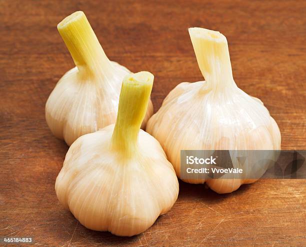 Pickled Garlic On Wooden Board Stock Photo - Download Image Now - Appetizer, Brown, Close-up