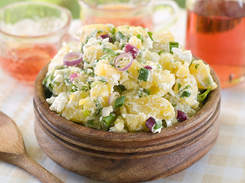 Potato salad with mayonnaise and spring onion, selective focus