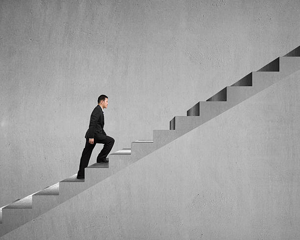 istock Businessman walking on stairs 465190699