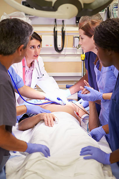 istock Medical Team Working On Patient In Emergency Room 465194005