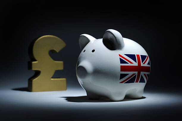 istock PIGGYBANK WITH BRITISH POUND SIGN 465194533