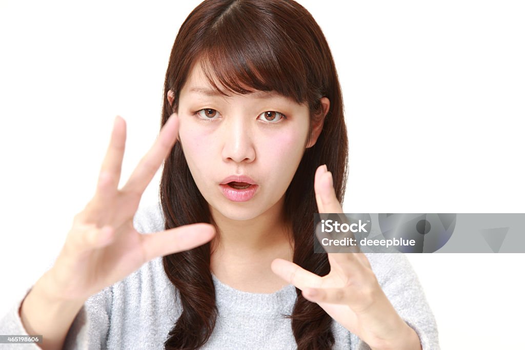 woman with supernatural power portrait of young Japanese woman with supernatural power on white background 20-29 Years Stock Photo