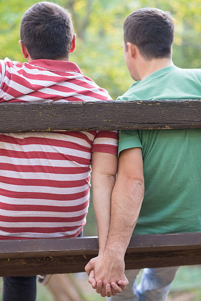 istock Gay couple in the park 465198997