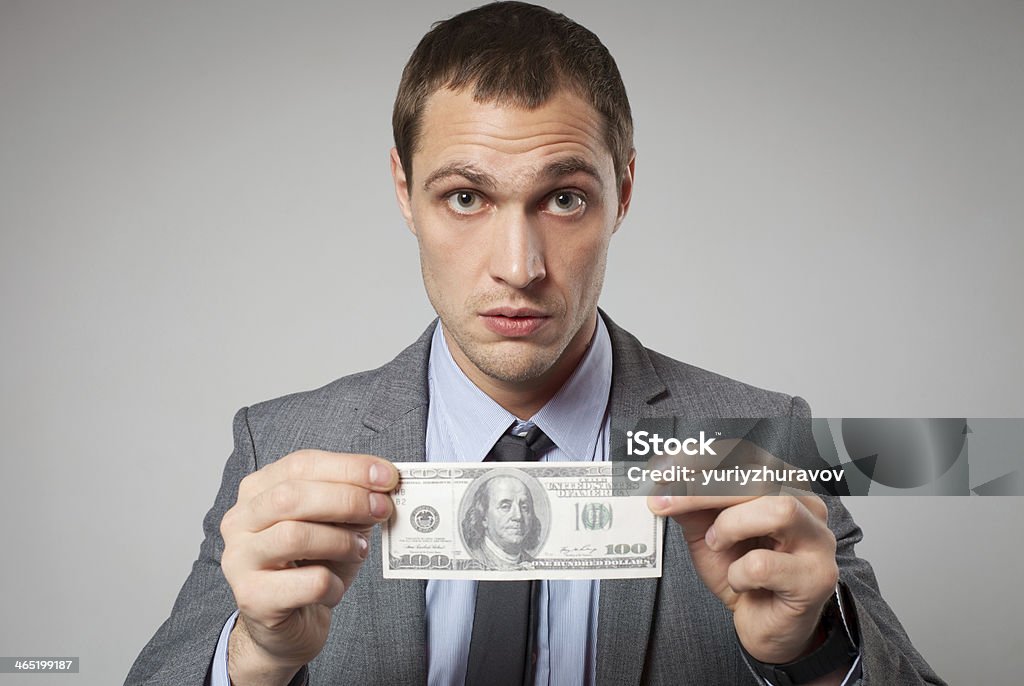 Portrait of a business man holding money Adult Stock Photo