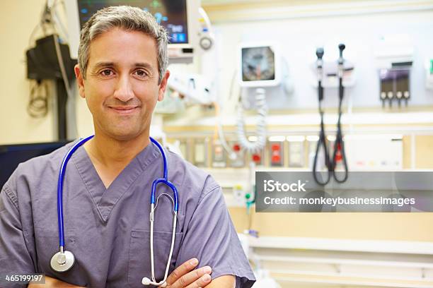 Portrait Of Male Doctor In Emergency Room Stock Photo - Download Image Now - Emergency Room, Doctor, Portrait