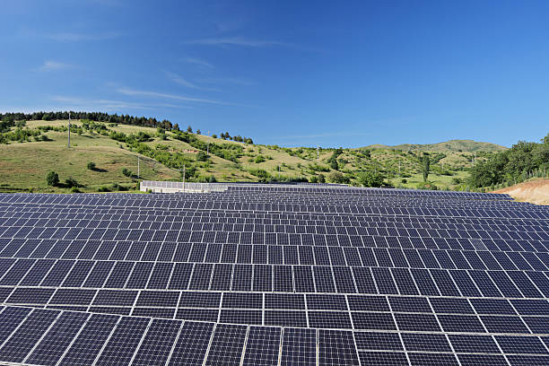 istock Solar photovoltaic cell panels under blue sky at Macedonia 465199531