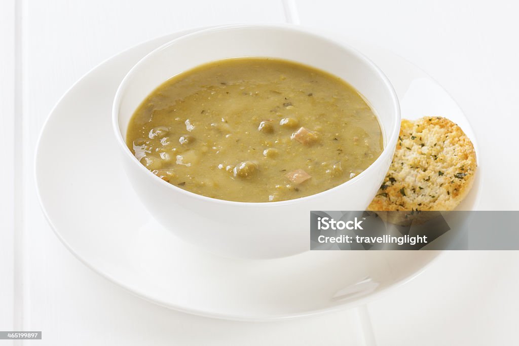 Pea and Ham Soup Pea and Ham Soup - small meal of half a can of pea and ham soup with one garlic toast. Total calories 180, or 754 kilojoules. Bowl Stock Photo