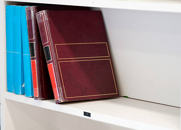 istock big old books on the white shelf 465205569