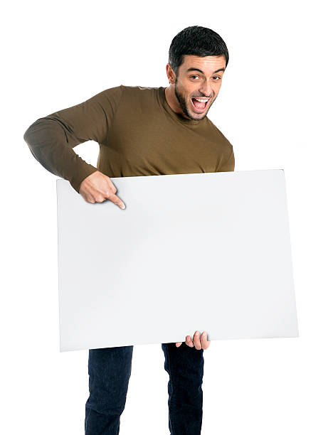istock Attractive man showing and pointing blank billboard 465206025