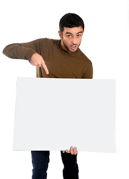 istock Attractive man showing and pointing blank billboard 465206029