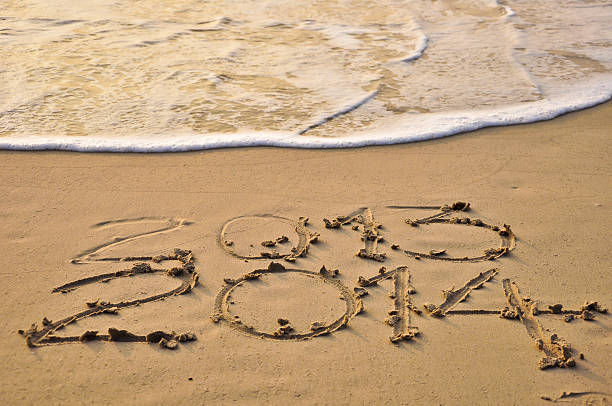 istock year 2014 made of small shell on the sandy beach 465206547