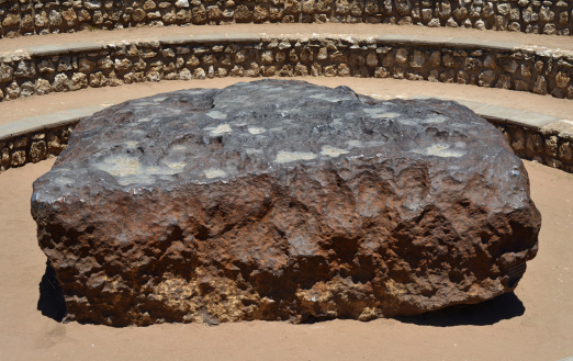 XXXLarge picture of Hoba, the biggest meteorite found on Earth, in Namibia. This tabloid body of metal measures 2.7×2.7×0.9 meters (8.9×8.9×3.0 ft), with mass estimated at 60 tons.
