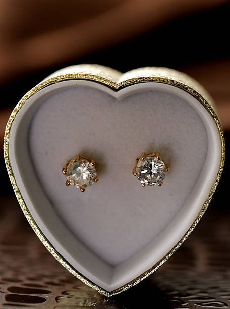 istock gold earrings stud with diamonds macro shot 465207139