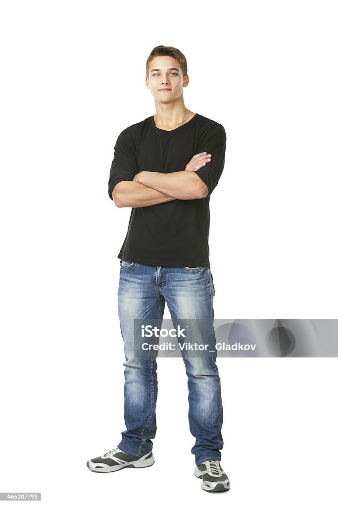 young man standing Full length portrait of young man standing with hands folded against isolated on white background Men Stock Photo