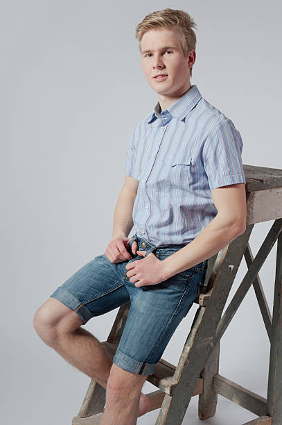 istock Young man stands near the ladder 465209155