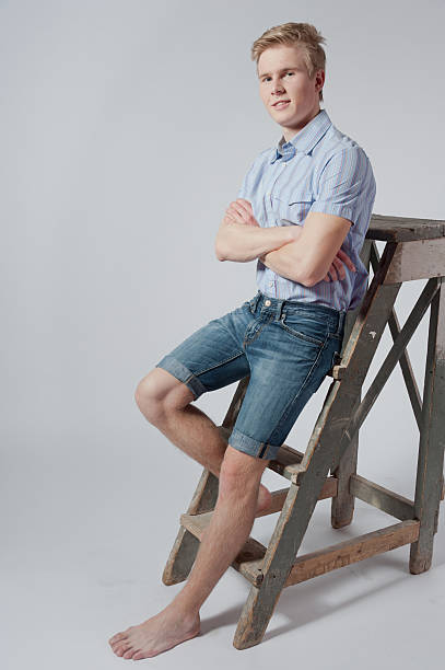 istock Young man stands near the ladder 465209203