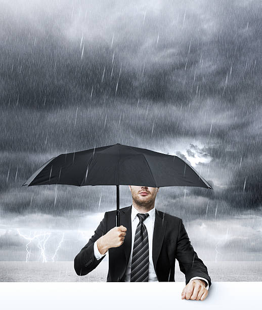 istock Businessman with umbrella 465215191