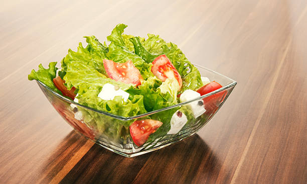 istock Green salat in a bowl on desk 465218329