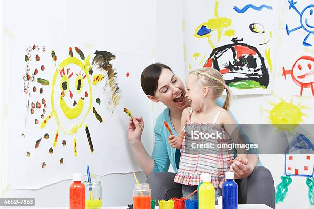 Teacher And Pupil In Pre School Art Class Stock Photo - Download Image Now - Fun, Messy, Mother