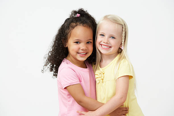 istock Two Pre School Girls Hugging One Another 465248077