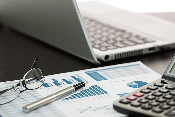 istock Businessman analyzing investment charts 465248079