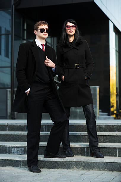 istock Young business couple against office building 465250097