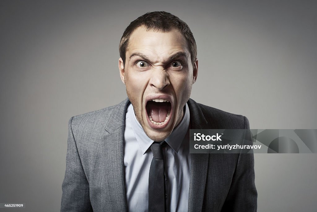 Angry businessman shouting Anger Stock Photo